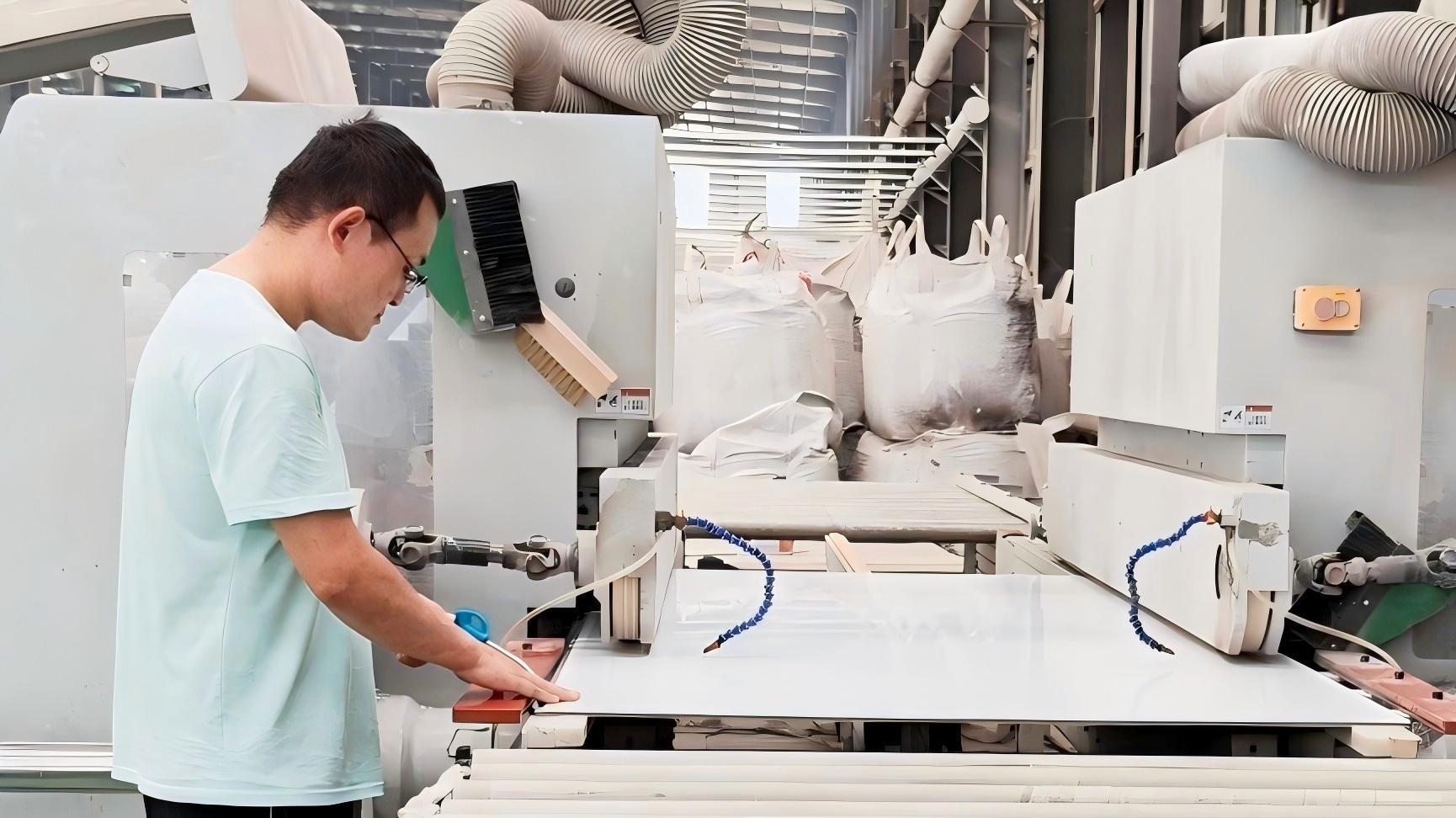 Professional Chinese male workers who produce wood veneer panels