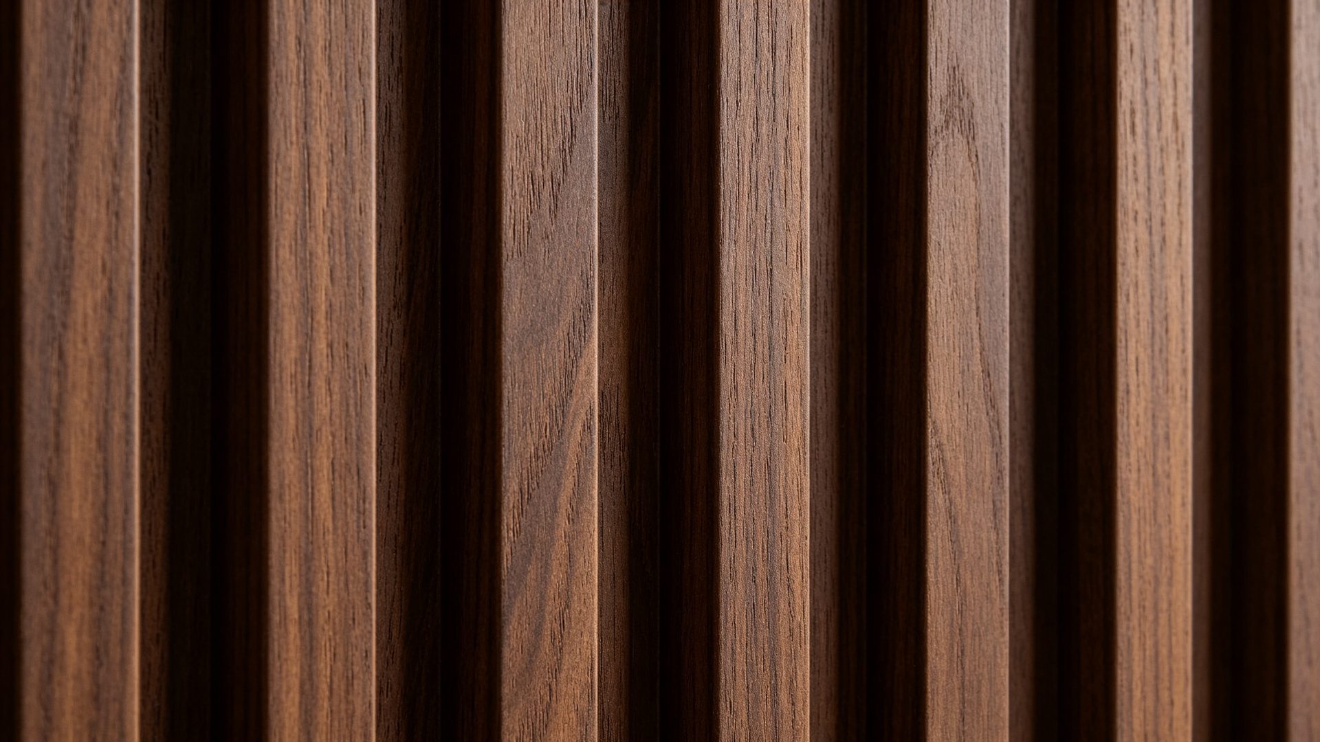 Close-up detail of WPC fluted wall panel texture in dark walnut